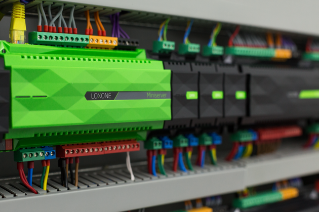 A professionally installed loxone miniserver and extensions inside a server cabinet